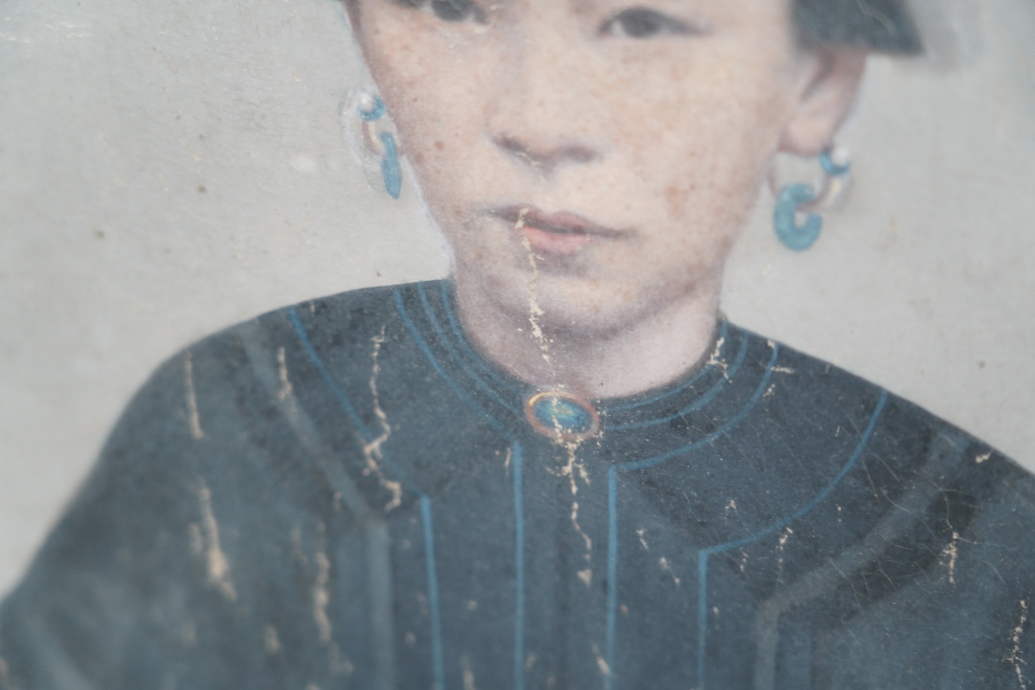 China Trade, late Qing dynasty, two portraits of Qing ladies, oil on canvas, each 63 x 47cm, later framed and glazed. Condition - poor to fair